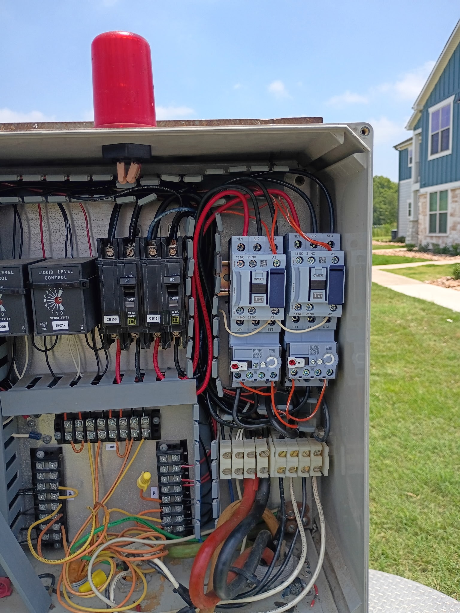 Electrical panel installation with liquid level controls