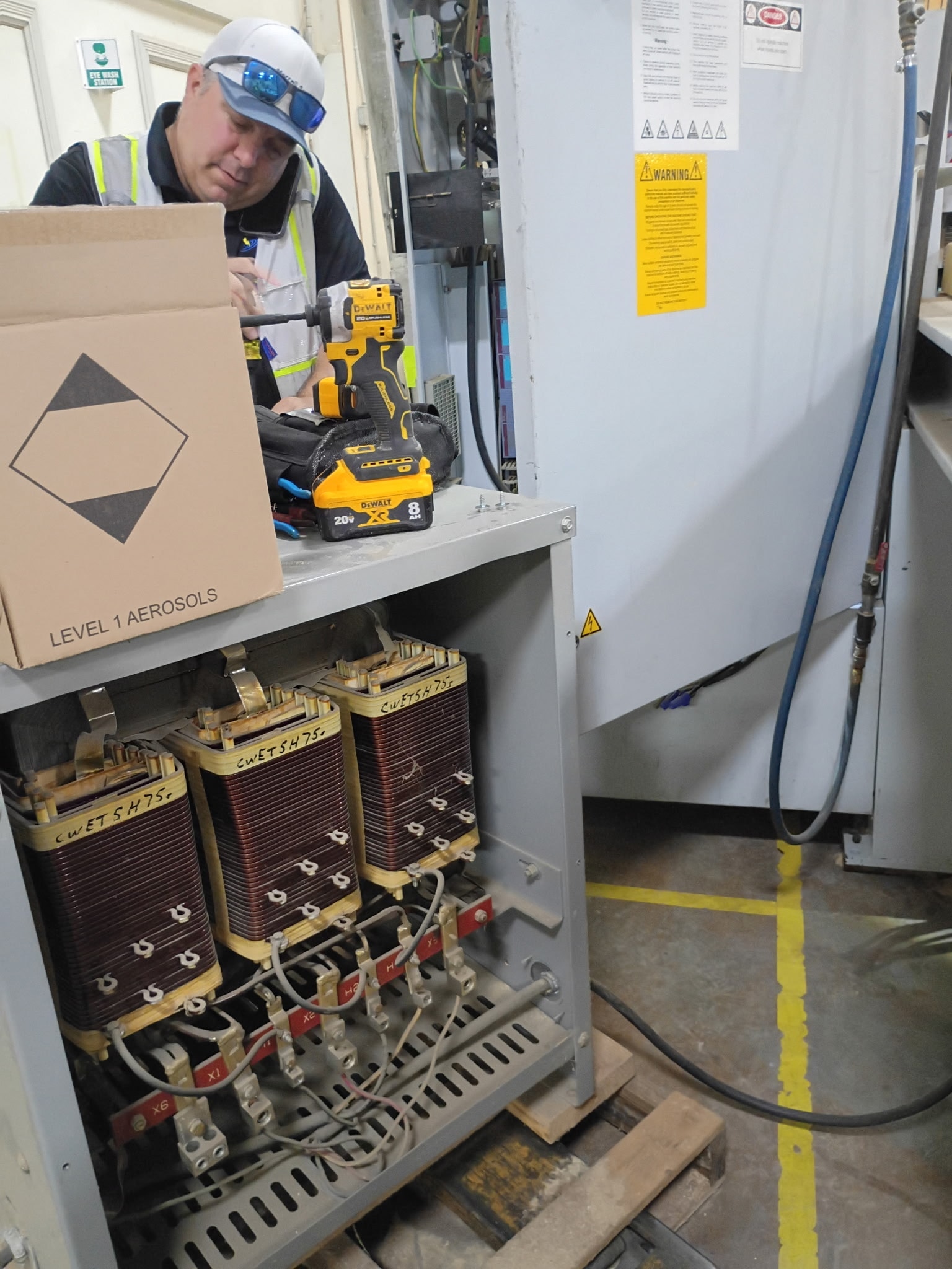 Merrell Services technician servicing industrial transformer